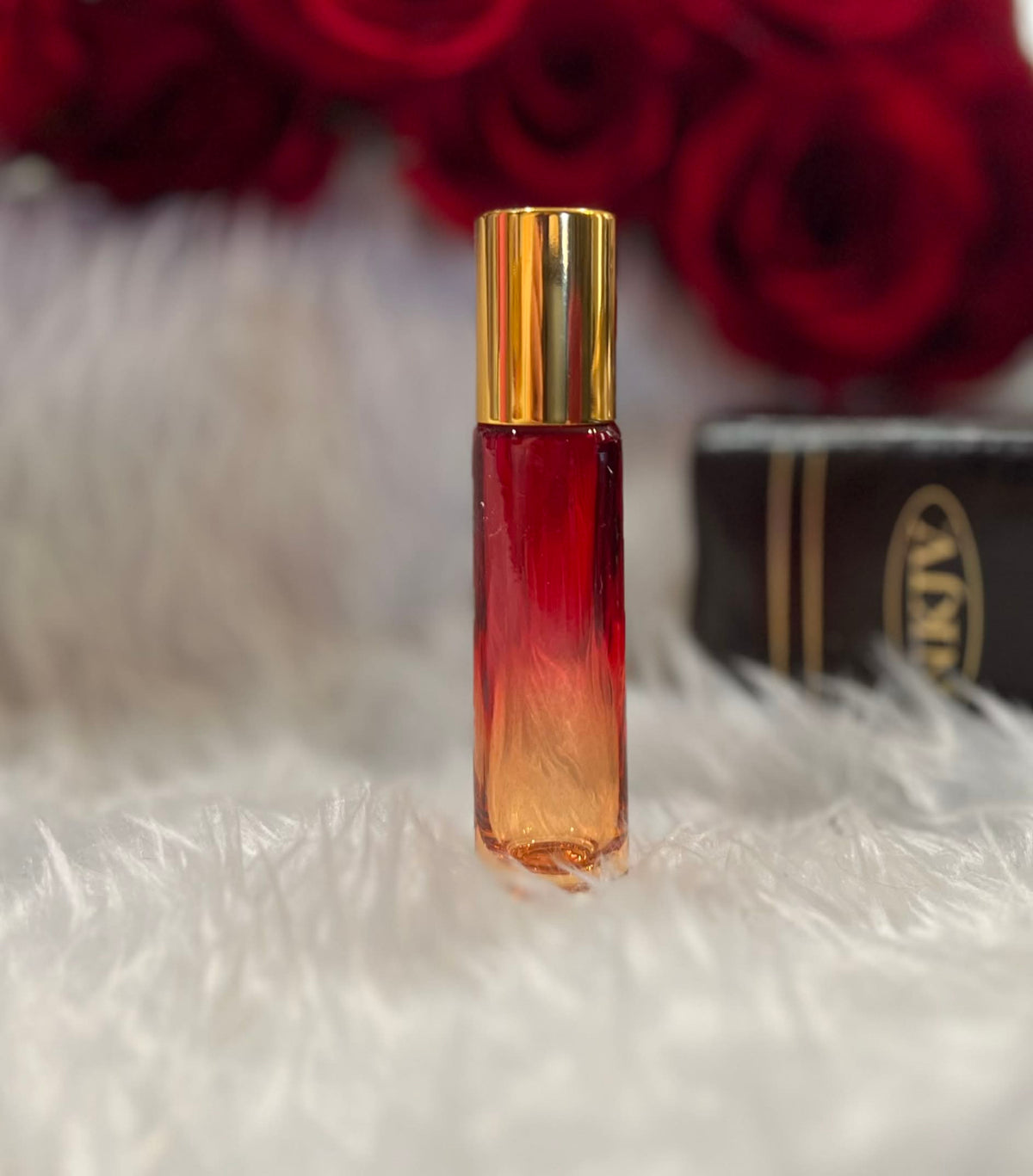 Red and orange ombre glass anointing oil roller bottle