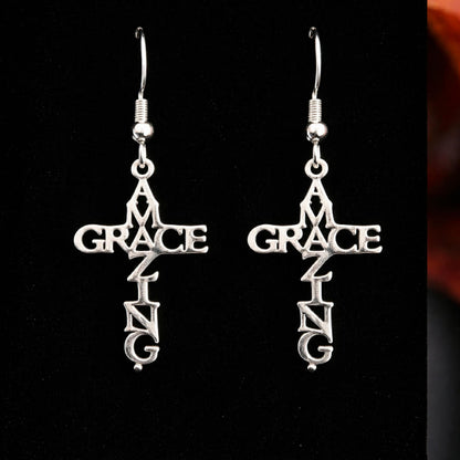 Amazing Grace cross earrings on black background
