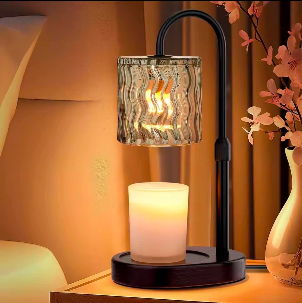 Black candle warmer lamp with a wavy glass shade warming a jar candle