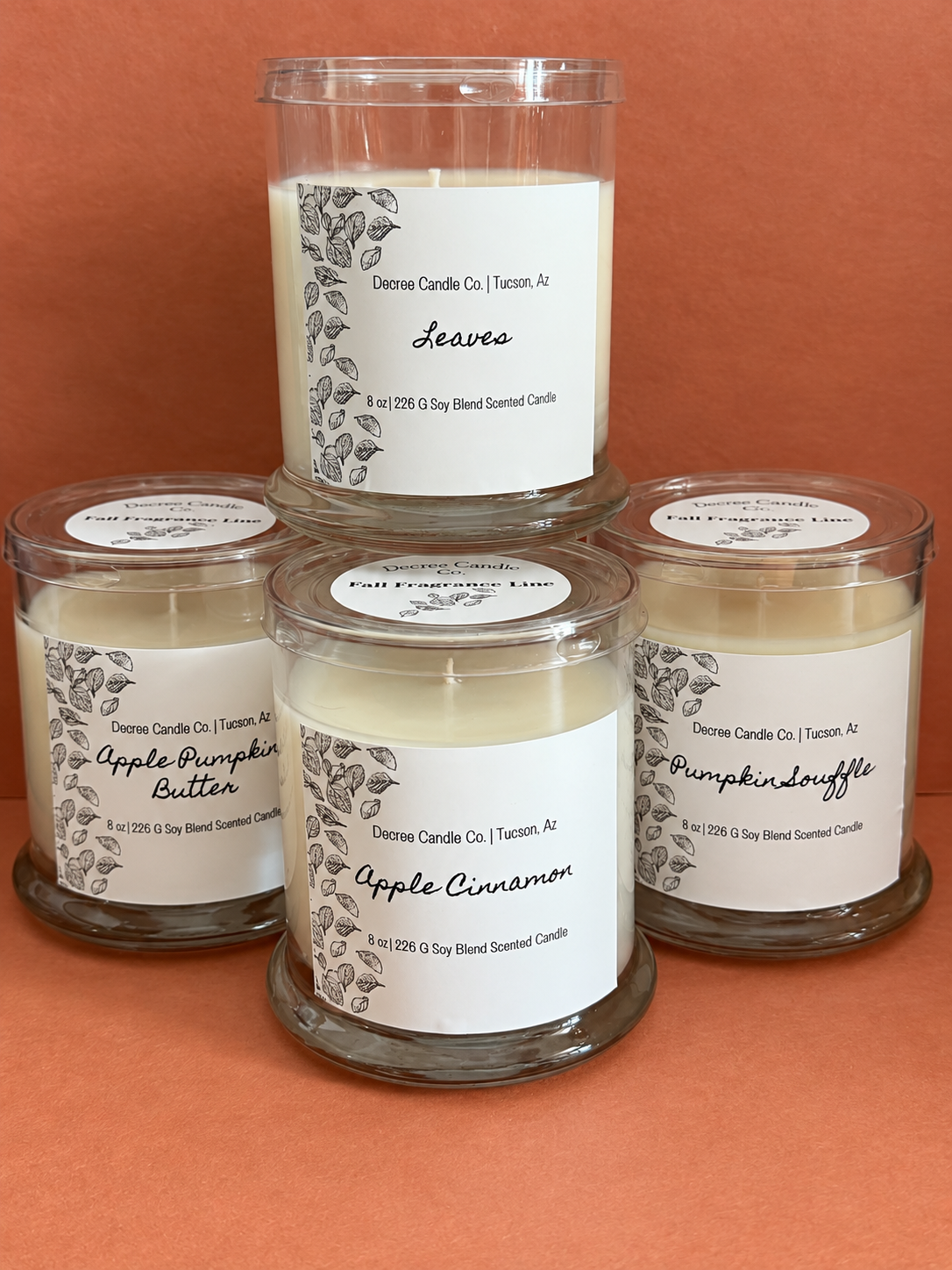 Decree Candle Co. fall candle collection featuring Leaves, Apple Pumpkin Butter, Apple Cinnamon, and Pumpkin Souffle