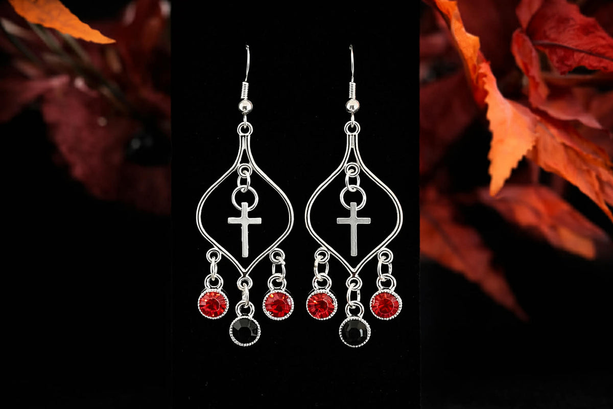 Silver Faith cross chandelier earrings with red and black gemstone-style drops