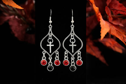 Silver Faith cross chandelier earrings with red and black gemstone-style drops