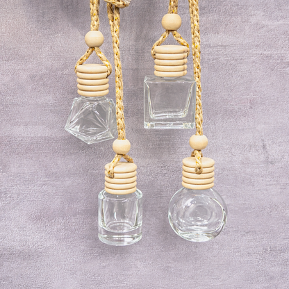 Hanging glass bottle diffusers by Decree Candle Co