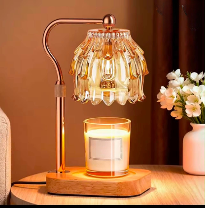 Gold candle warmer lamp with crystal style shade warming a jar candle