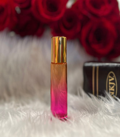 Orange and pink ombre glass anointing oil roller bottle