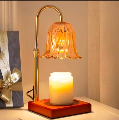Red wood-base candle warmer lamp with scalloped glass shade warming a jar candle